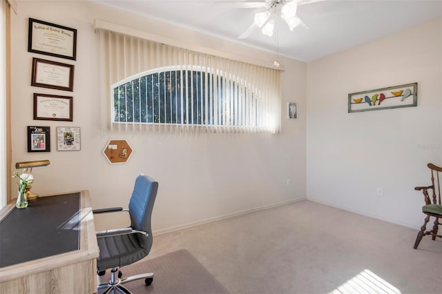 office area with light carpet, plenty of natural light, and ceiling fan