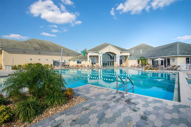 view of swimming pool with a patio