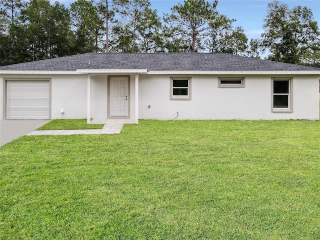 ranch-style house with a garage and a front yard