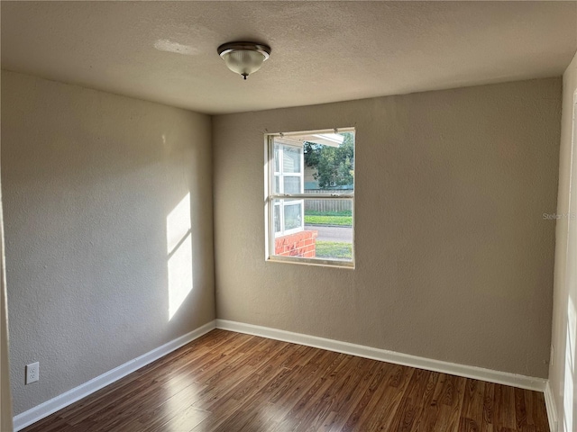 empty room with wood-type flooring