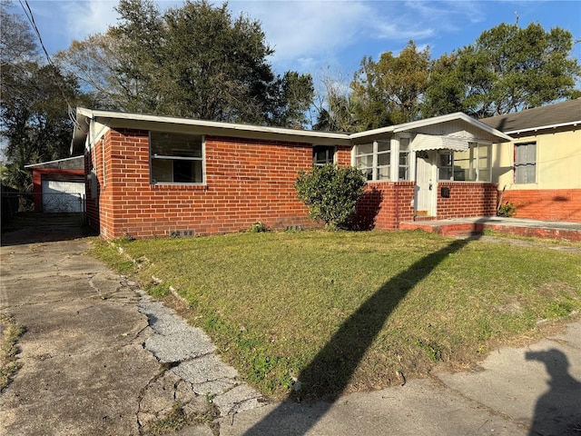 ranch-style house with a front lawn