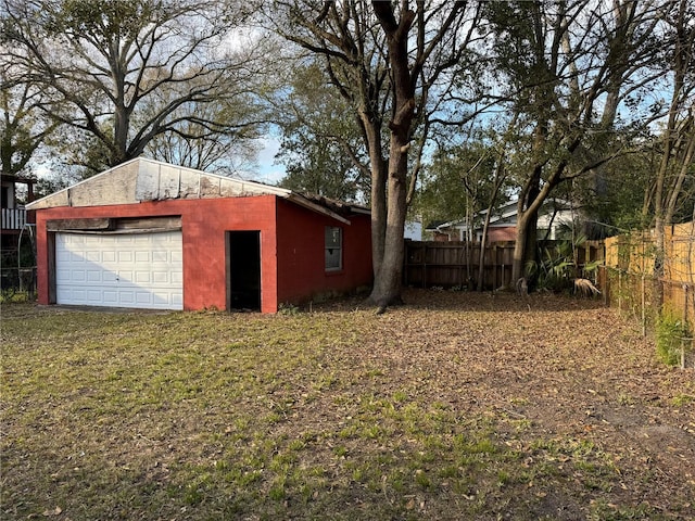 exterior space featuring an outdoor structure and a garage