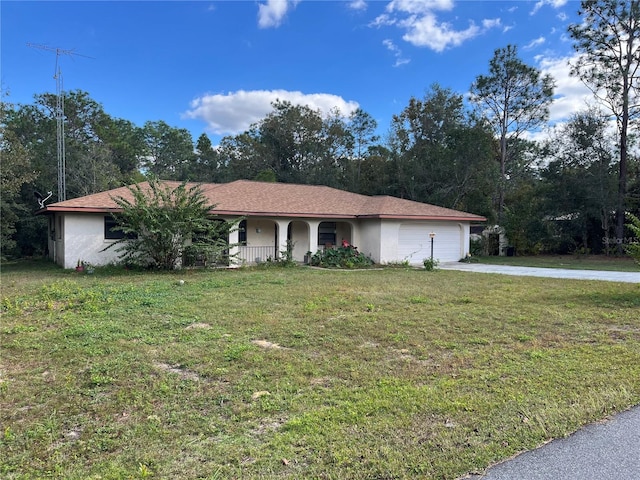 single story home featuring covered porch and a front lawn