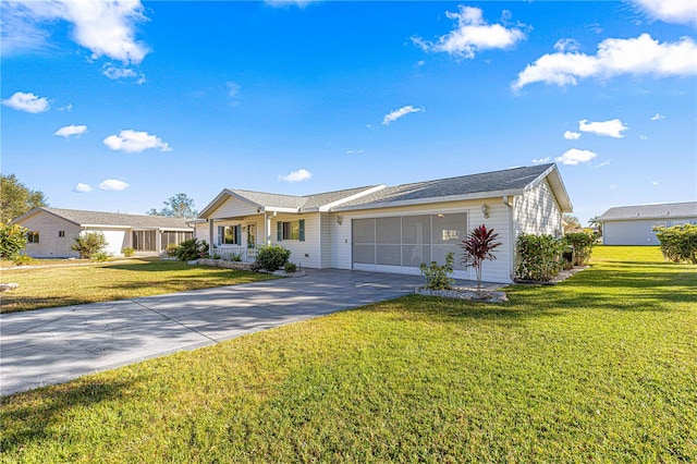 single story home with covered porch, a front yard, and a garage