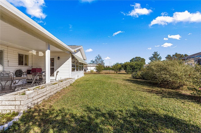 view of yard featuring ceiling fan