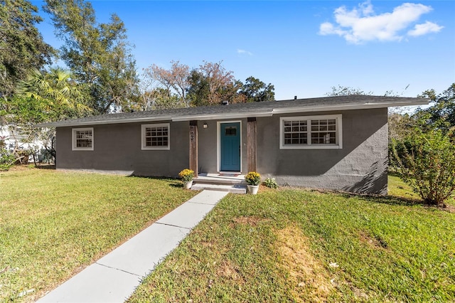 ranch-style house with a front lawn