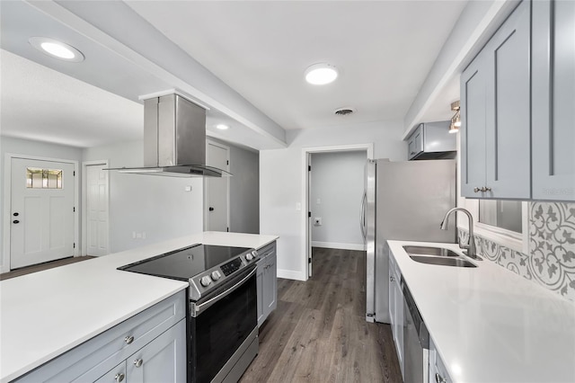 kitchen featuring island exhaust hood, appliances with stainless steel finishes, gray cabinetry, sink, and light hardwood / wood-style floors