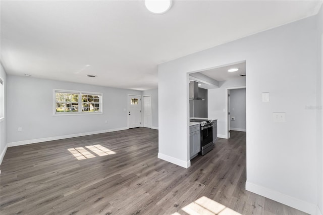 unfurnished living room featuring dark wood-type flooring