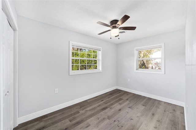 unfurnished room featuring hardwood / wood-style floors, a textured ceiling, and ceiling fan