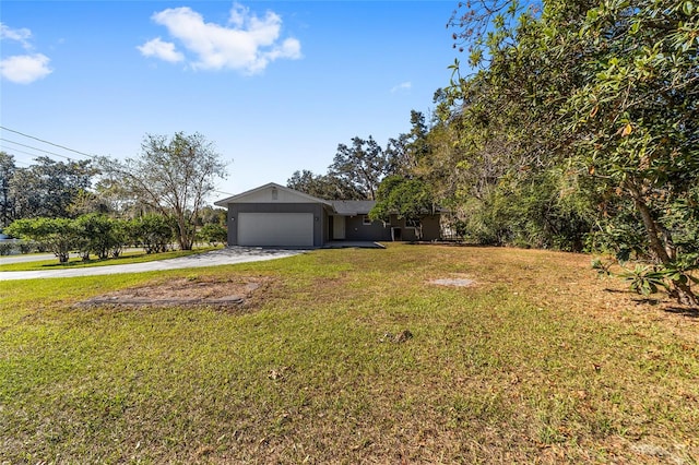 view of front of property featuring a garage and a front lawn