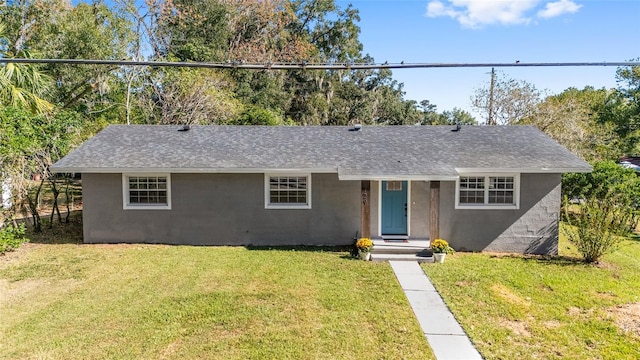 ranch-style home with a front lawn