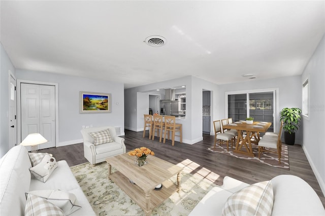 living room featuring dark hardwood / wood-style flooring