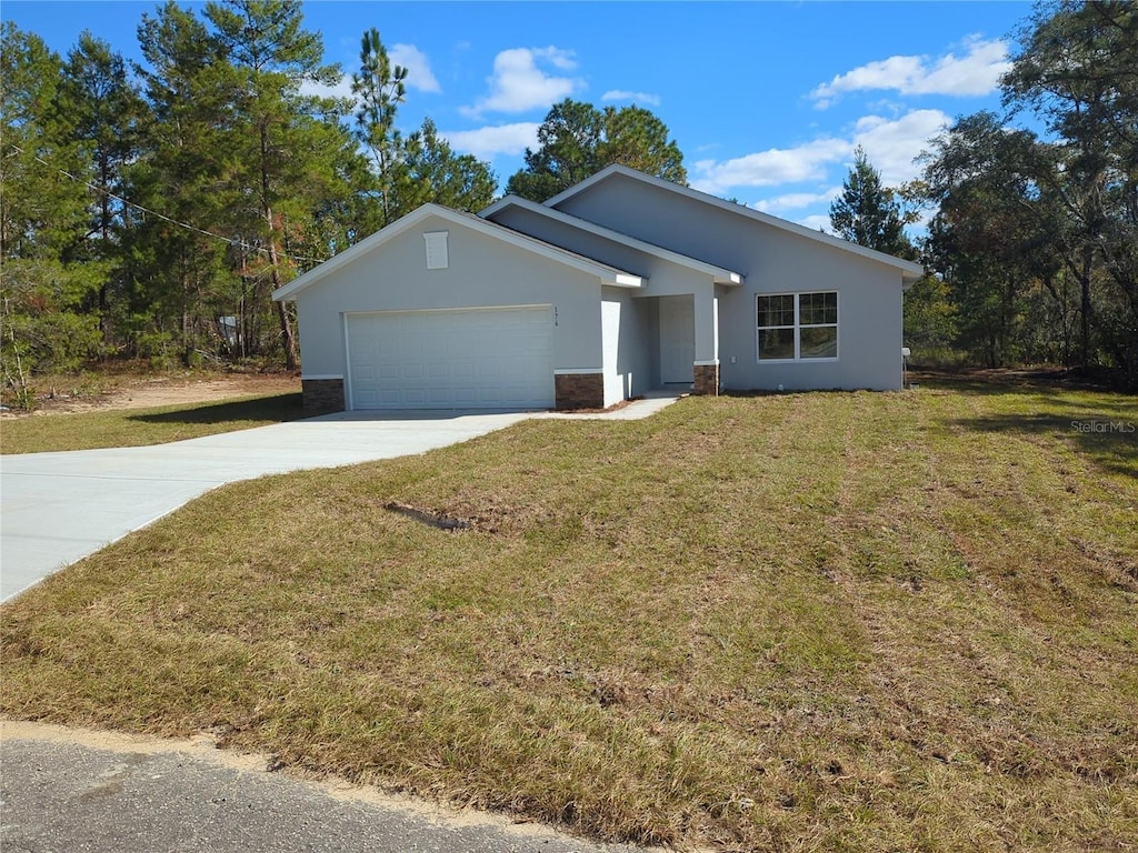 single story home featuring a front yard and a garage