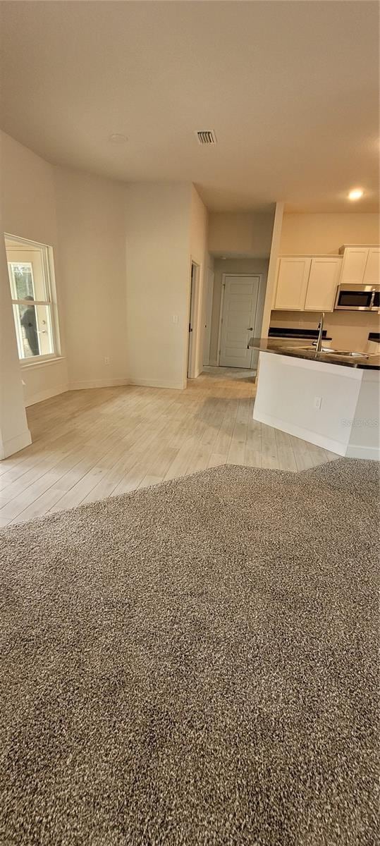 interior space with visible vents and light wood-style floors