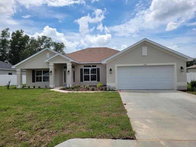 11610 SW 59th Ter, Ocala, FL 34476 - ranch-style home with stucco siding, concrete driveway, and a garage