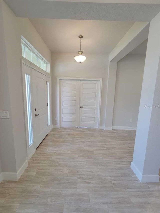 11610 SW 59th Ter, Ocala, FL 34476 - entrance foyer with baseboards and light wood-style flooring