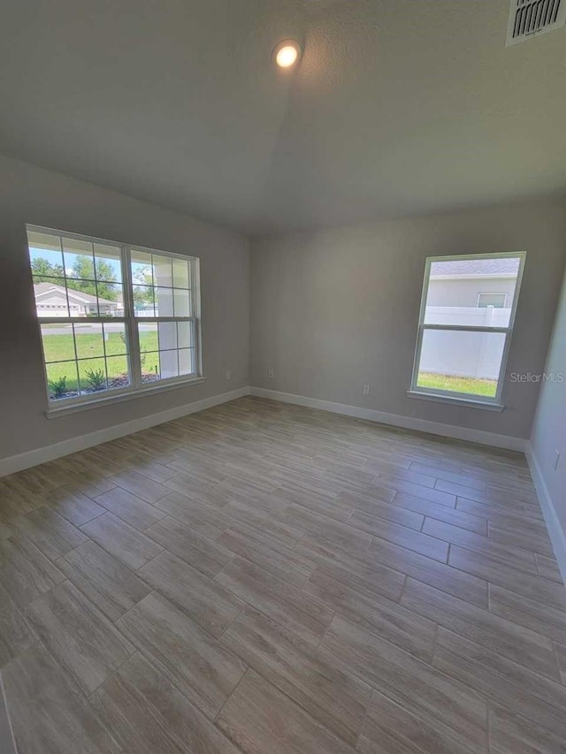 11610 SW 59th Ter, Ocala, FL 34476 - spare room with wood finished floors and recessed lighting