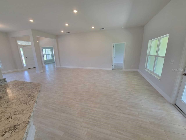 11610 SW 59th Ter, Ocala, FL 34476 - unfurnished living room with light wood finished floors and recessed lighting