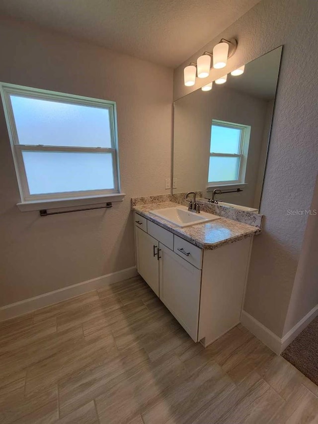 11610 SW 59th Ter, Ocala, FL 34476 - bathroom with vanity, a textured wall, and a textured ceiling