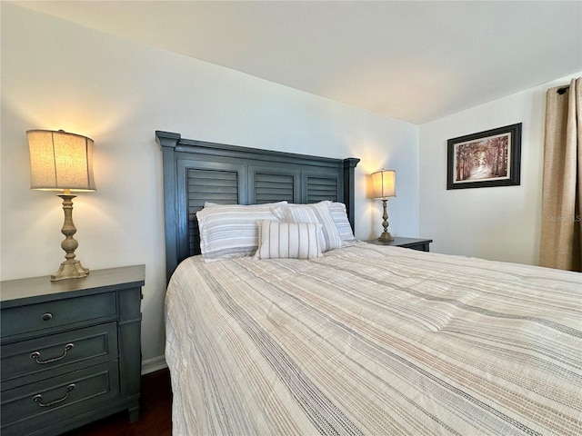 bedroom featuring dark hardwood / wood-style floors