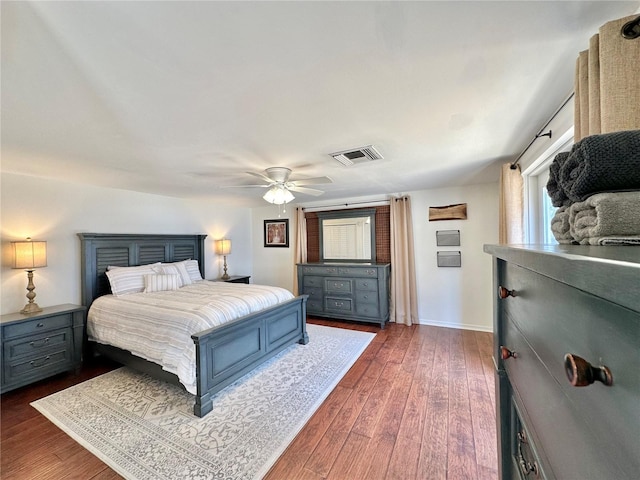 bedroom featuring ceiling fan and dark wood-type flooring