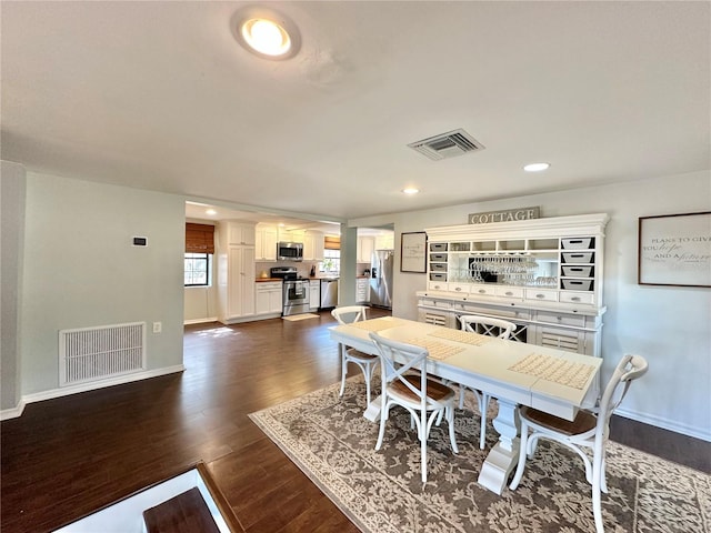 dining area featuring dark hardwood / wood-style floors