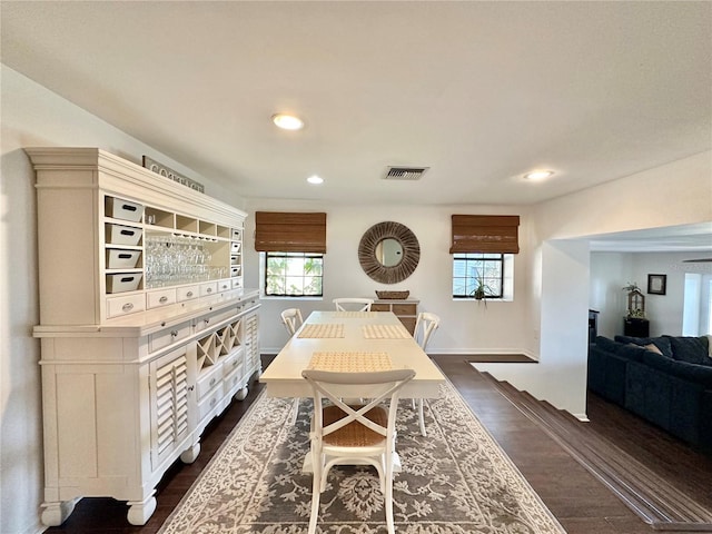 dining area featuring dark hardwood / wood-style flooring