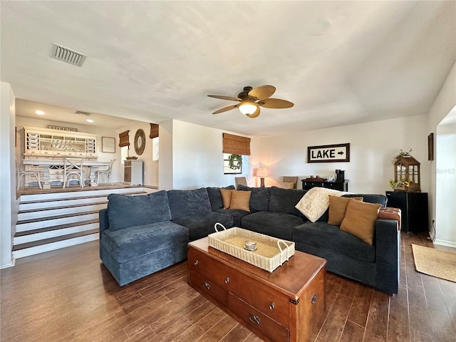 living room with dark hardwood / wood-style floors and ceiling fan