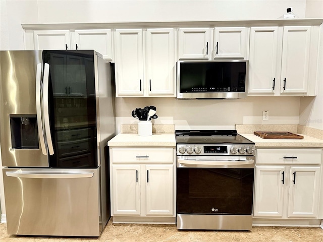 kitchen featuring white cabinets and stainless steel appliances