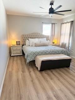 bedroom featuring wood-type flooring and ceiling fan