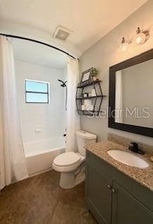 full bathroom with vanity, shower / bath combination with curtain, and toilet