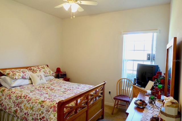 bedroom with ceiling fan and carpet