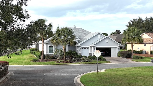 ranch-style home featuring central AC and a front yard