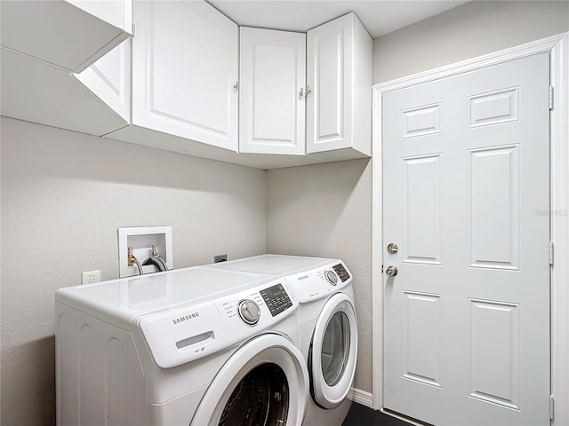 laundry area featuring cabinets and washer and dryer