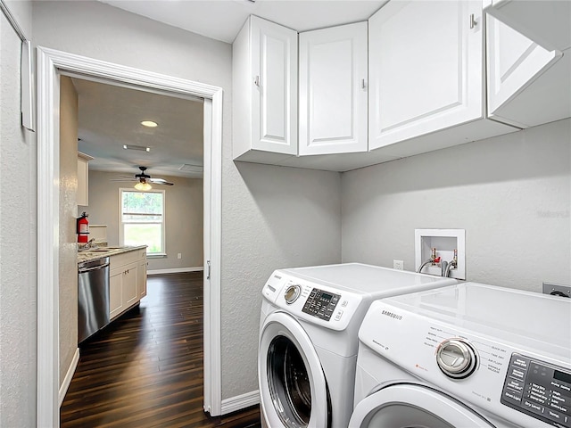 laundry room featuring ceiling fan, dark hardwood / wood-style flooring, cabinets, and independent washer and dryer