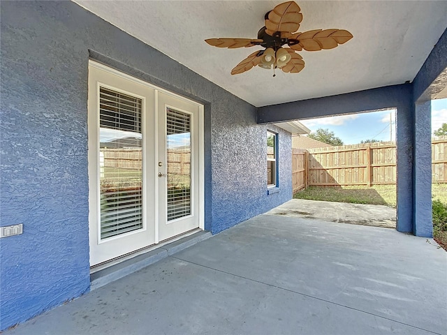 view of patio with french doors and ceiling fan