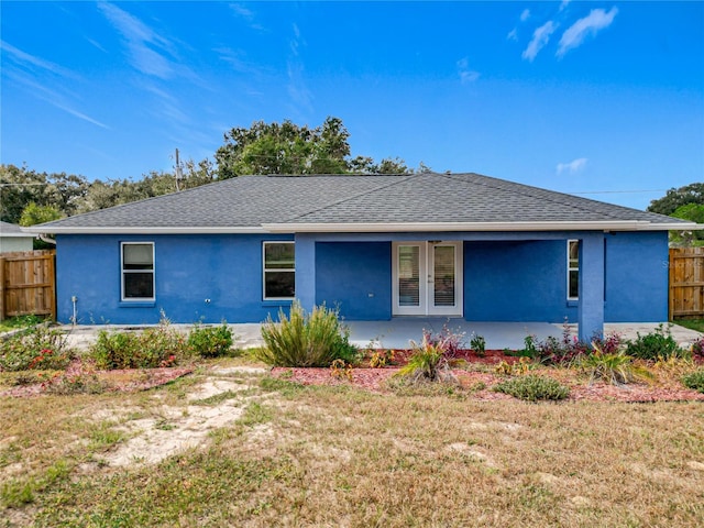 view of front of property with a front yard and a patio area