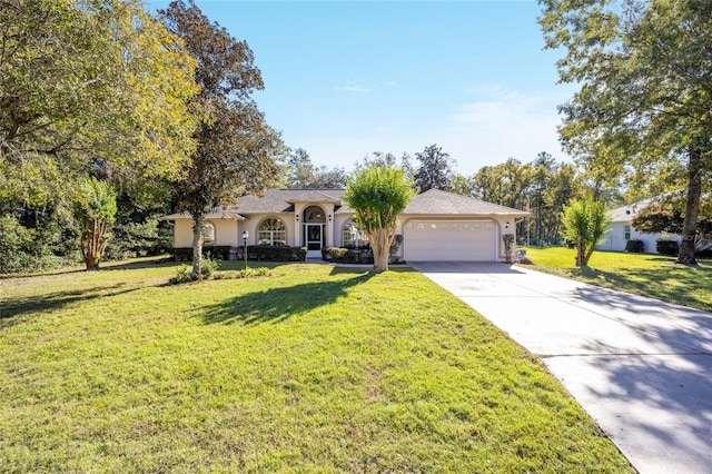 single story home featuring a garage and a front yard