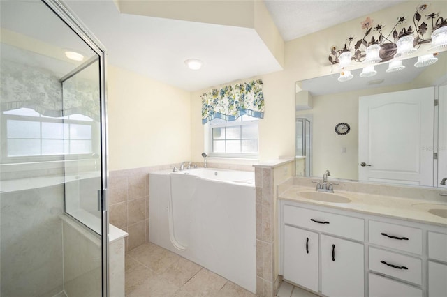 bathroom with tile patterned flooring, vanity, separate shower and tub, and tile walls