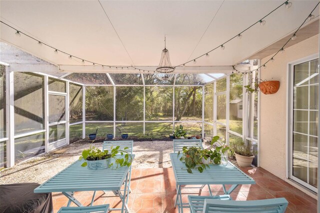 5336 SW 109th Place Rd, Ocala, FL 34476 - sunroom / solarium featuring a chandelier
