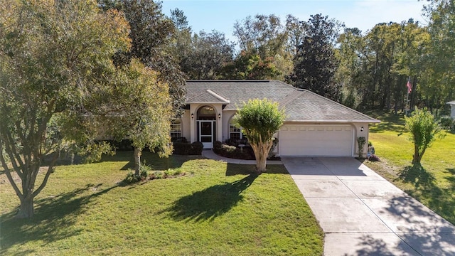 view of front facade with a garage and a front lawn