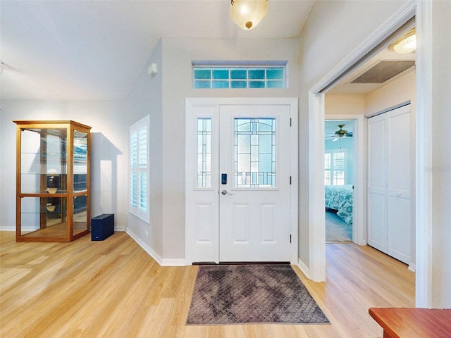 foyer entrance with light hardwood / wood-style flooring