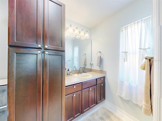 bathroom with vanity and a wealth of natural light