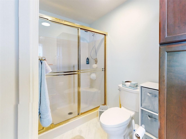 bathroom with toilet and walk in shower