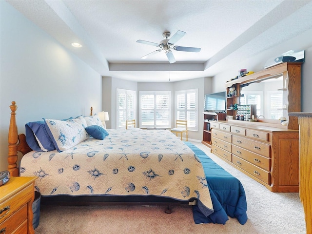 bedroom with ceiling fan and light colored carpet