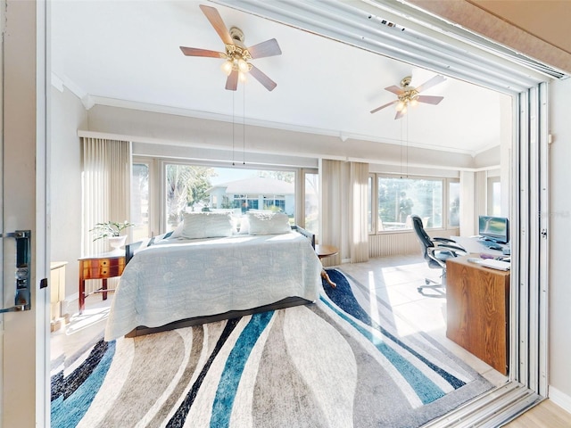 bedroom with light wood-type flooring, ceiling fan, and ornamental molding