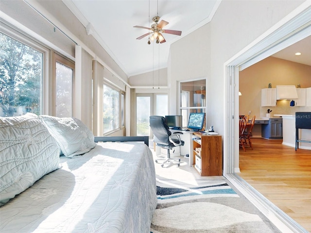 bedroom with ceiling fan, lofted ceiling, ornamental molding, and light hardwood / wood-style flooring