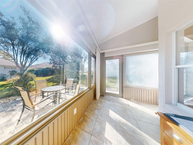 sunroom featuring vaulted ceiling