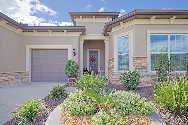 view of exterior entry featuring a garage