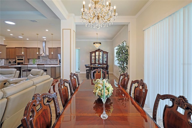 dining space featuring dark hardwood / wood-style floors, ornamental molding, and a notable chandelier